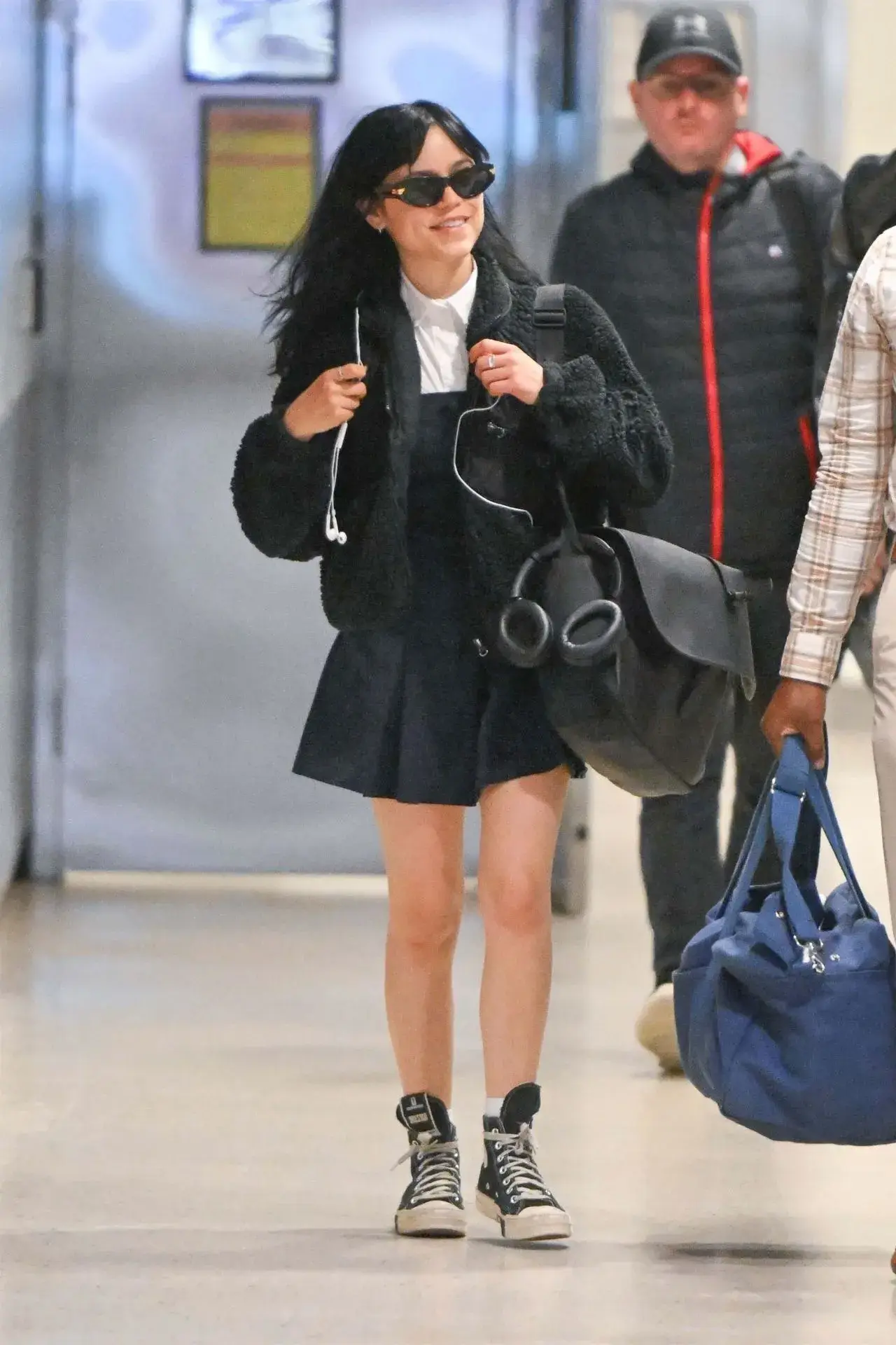 American actress Jenna Ortega Stills in Blue dress at JFK Airport